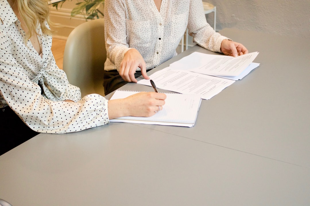 A person and professional reviewing a support plan together